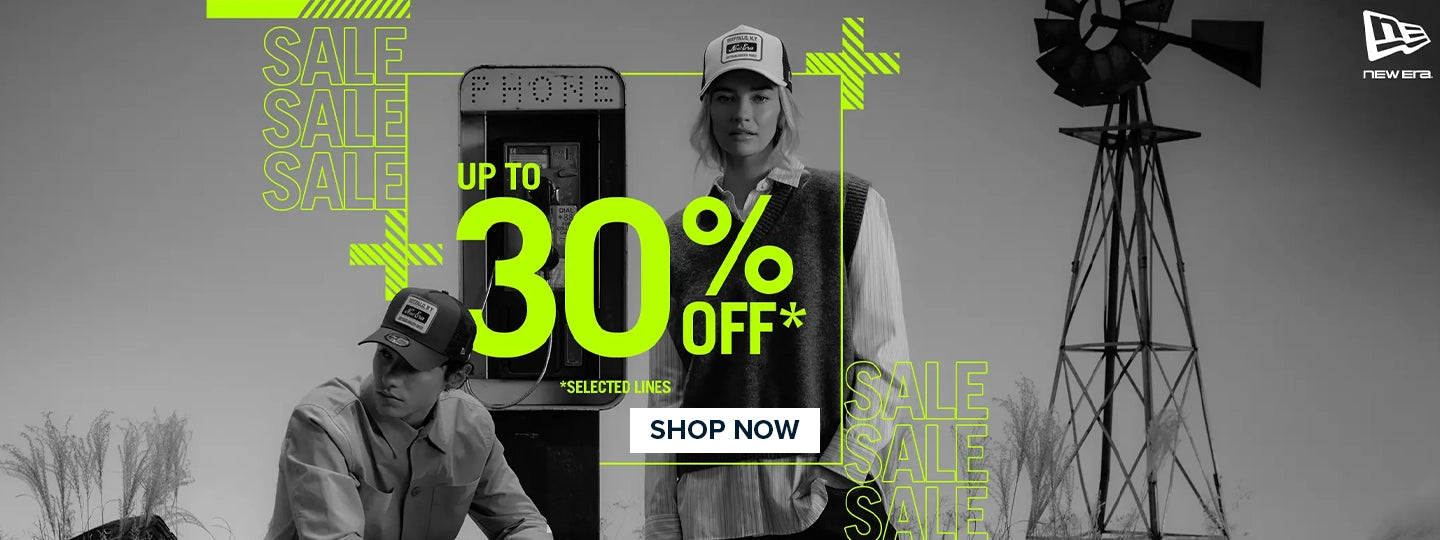 Three models wearing New Era caps and MLB apparel under dark lighting – Flat 10% Off banner with “Shop Now” CTA